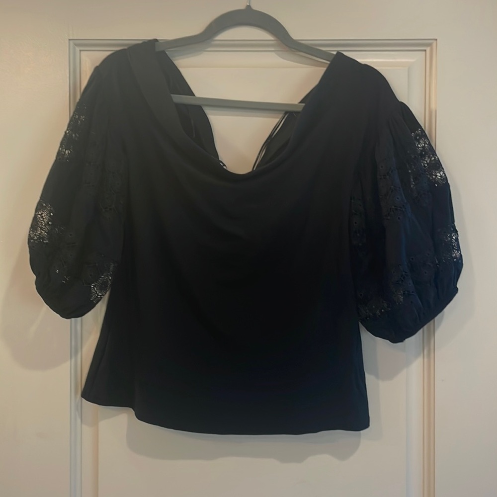 Black off shoulder top.
